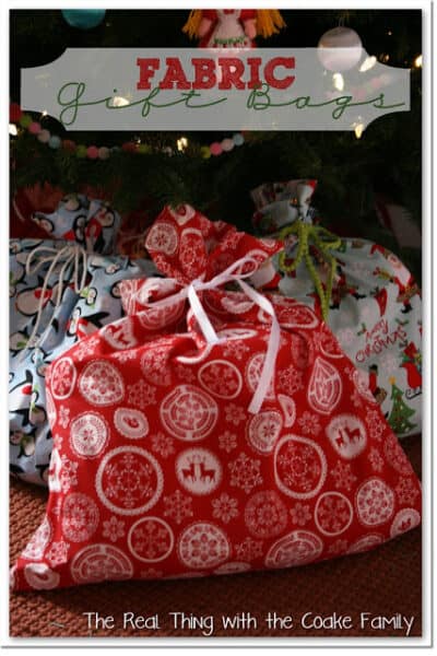 fabric gift bags under a Christmas tree