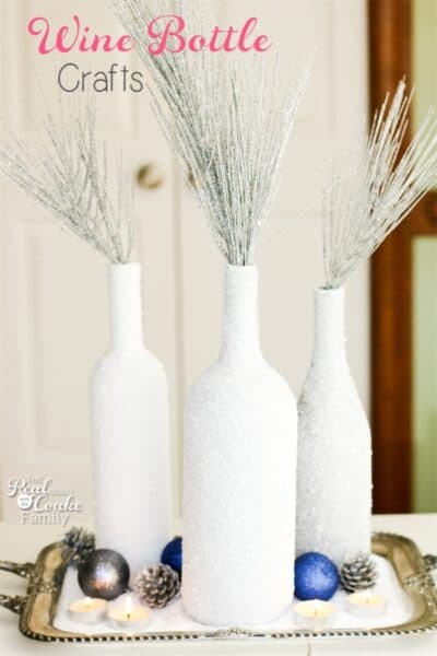 I love wine bottle crafts! This is a tutorial to make this beautiful and inexpensive diy wine bottle centerpiece. Perfect winter home decor!!