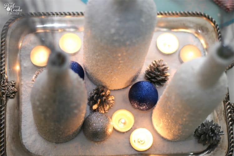 Gorgeous DIY winter Centerpiece made from wine bottles and epsom salt. This will be perfect in my home decor!