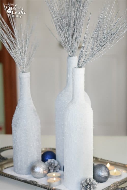 Gorgeous DIY winter Centerpiece made from wine bottles and epsom salt. This will be perfect in my home decor!