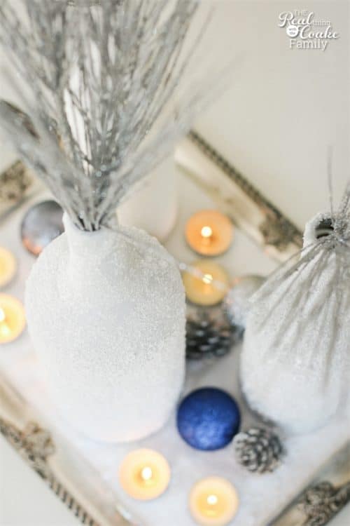 Gorgeous DIY winter Centerpiece made from wine bottles and epsom salt. This will be perfect in my home decor!