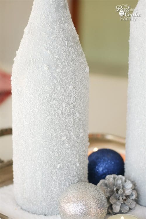 Gorgeous DIY winter Centerpiece made from wine bottles and epsom salt. This will be perfect in my home decor!