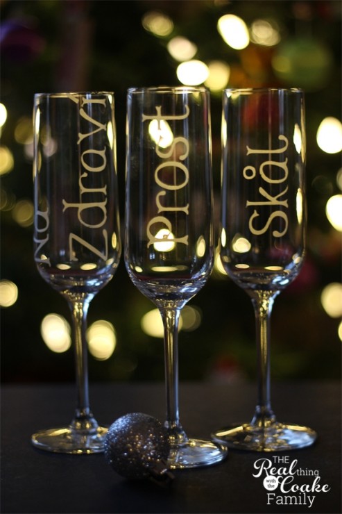 New Year's champagne glasses personalized with glass etching to toast in 6 different languages. Easy DIY for New Year's celebrating. #ChampagneGlasses #NewYears #DIY