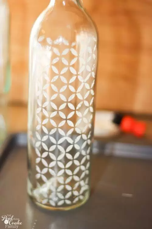 wine bottle showing pattern created after removing stencil