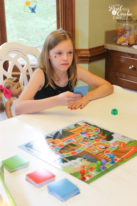 Plan a  family game night to promote conversation, connection and fun as a family! #FamilyGameNight #GameNight #FamilyFun #Qsracetothetop #pmedia #ad #RealCoake