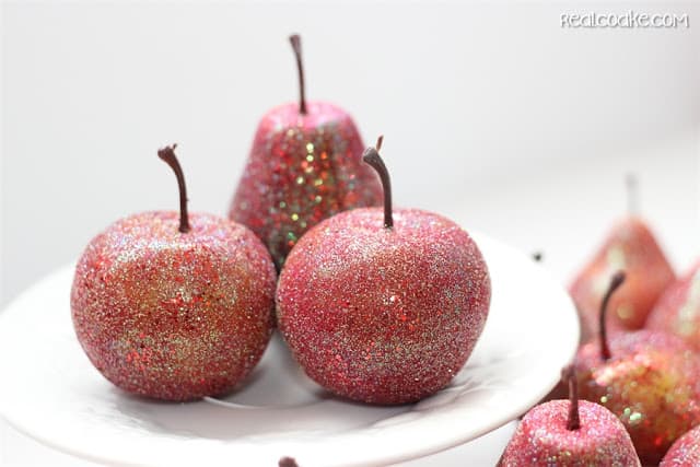 fake apples with glitter on them