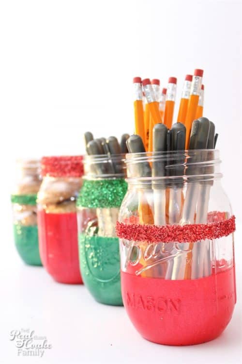 Love these DIY glittery Christmas mason jars. They are so pretty and look filled with pens and pencils for a teacher gift. 