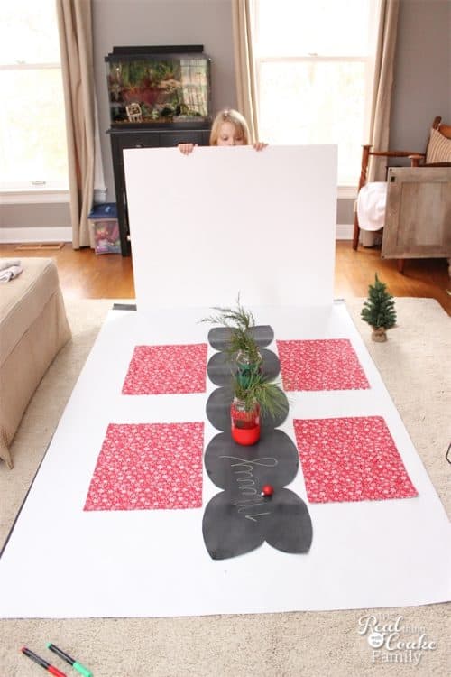 I love this DIY Chalkboard table runner! So pretty and could be used in our Christmas decorations or any time of year.