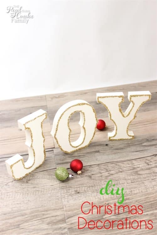 I love these glittery Joy DIY Christmas decorations! They are so cute and they look easy too!.