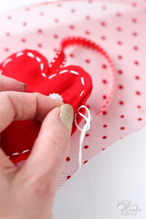 Valentine's Day crafts like this adorable garland for my home decor are so fun to make and look at. Can't wait to use this in my decorations this year!