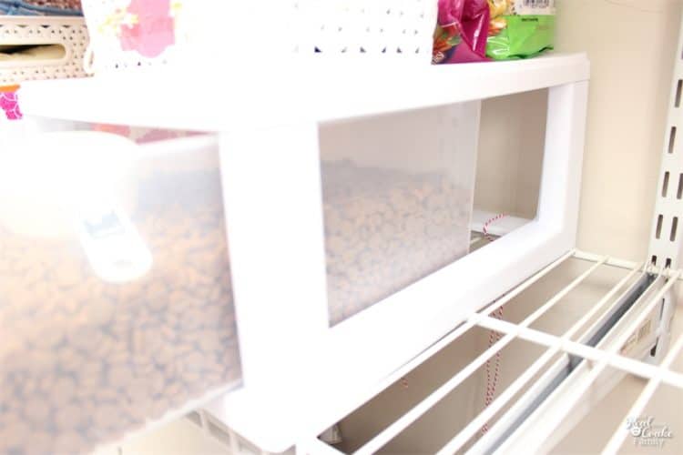 What a cute and genius idea for organizing Pet Food! This DIY works really well and helps save a ton of space in my home. 