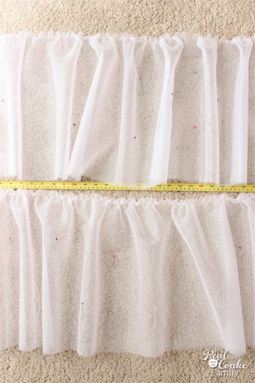 Bed Skirts can be so expensive! Instead you can make this cute sparkly tulle bed skirt. It is fairly easy easy sewing to make this diy bed skirt. Sponsored