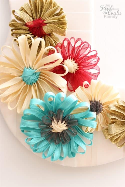 What a fun idea! Take an unfinished wood picture frame and turn it into a diy wreath with cute ribbon flowers. Great inexpensive idea for my home decor.