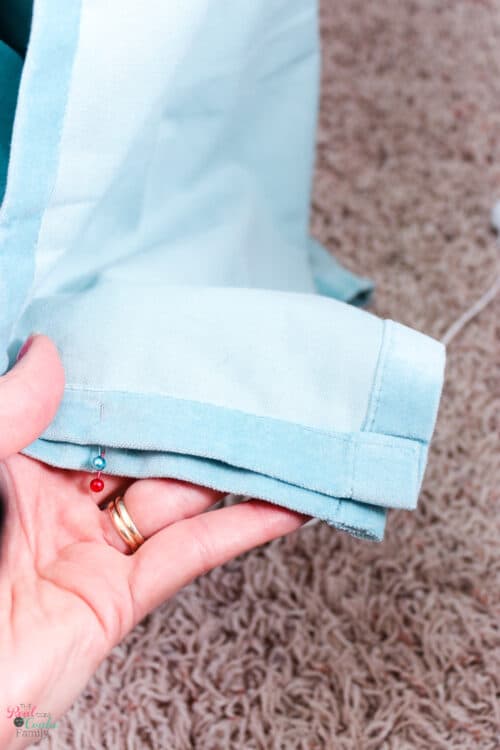 pins on both sides of one panel of curtains