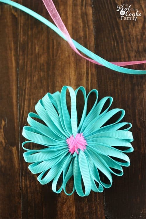 I love simple crafts like these single layer ribbon flowers. Cute and easy! There is a full tutorial on how to make a flower from ribbon.