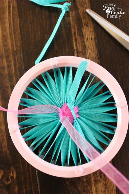I love simple crafts like these single layer ribbon flowers. Cute and easy! There is a full tutorial on how to make a flower from ribbon.