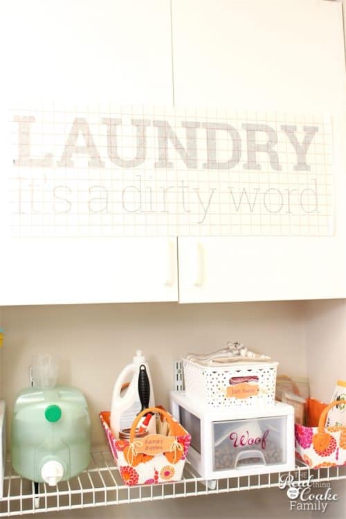 Great laundry room vinyl lettering diy! Love the quote and the way to add some color and space savings to the laundry room decor. 