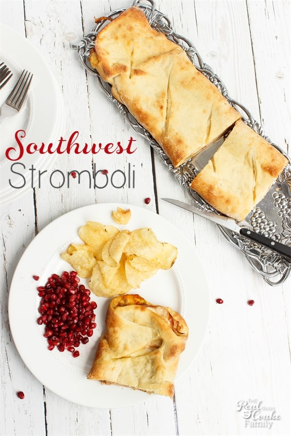 southwest Stromboli on a plate with chips and pomegranate seeds