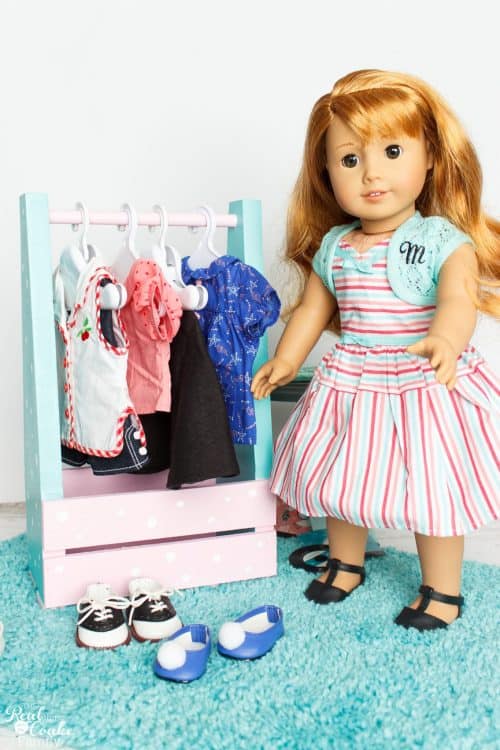 Cuteness! This is such a cute DIY American Girl idea to make a portable clothes closet. Perfect to hold all the American Girl Doll stuff and accessories. 