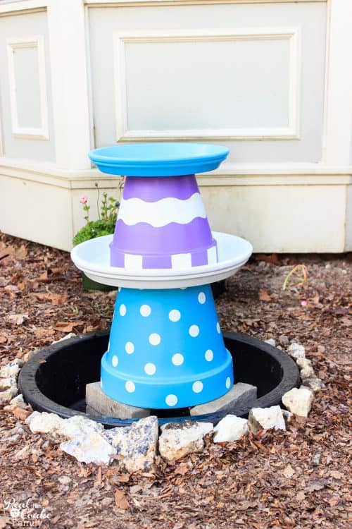 Great outdoor water feature idea for the yard. Love the colors and whimsy of this DIY small water fountain that can also be a bird bath