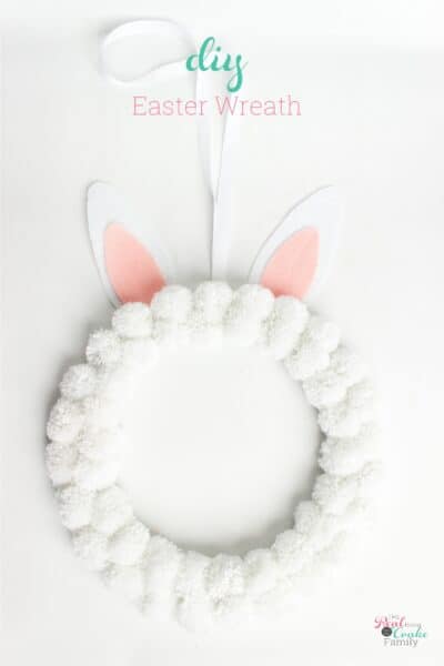 Make this cute DIY Bunny Easter Wreath! It's an easy Easter craft that uses pom poms and makes cute decorations for your home.