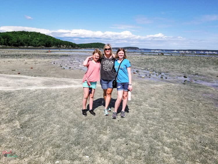3 people standing in Sand Bar at Acadia National Park