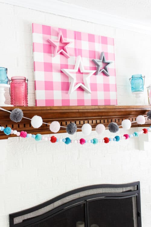 pink, white, and gray stars shown on mantel in home decor